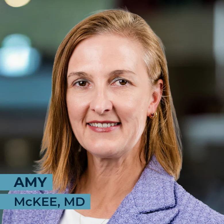A woman with straight, shoulder-length blonde hair, wearing a lavender blazer and smiling; text reads "Amy McKee, MD.